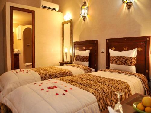 Llit o llits en una habitació de Riad Lila