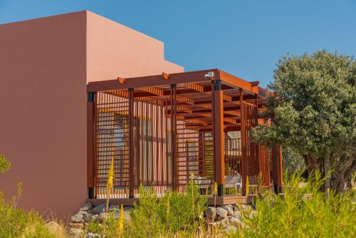 a building with a deck on the side of it at Sahab Resort and Spa, Jabal Al Akhdar in Al ‘Aqar