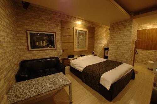 Postel nebo postele na pokoji v ubytování Hotel Allure (Adult Only)