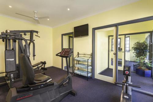 a fitness room with a treadmill and a gym at Best Western Olde Maritime Motor Inn in Warrnambool