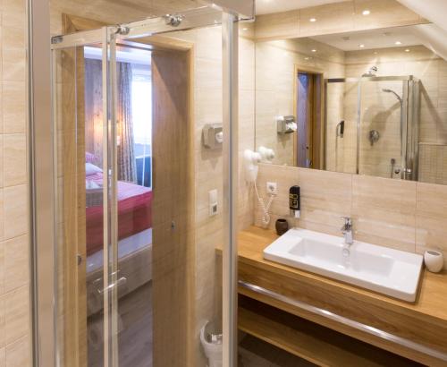 a bathroom with a sink and a mirror at Villa Ambach in Oetz
