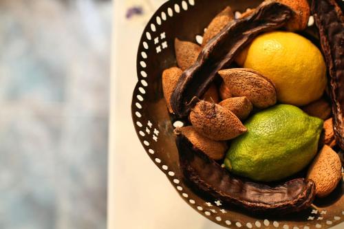 a basket filled with fruit and nuts on a table at Tvrdic Honey in Grohote