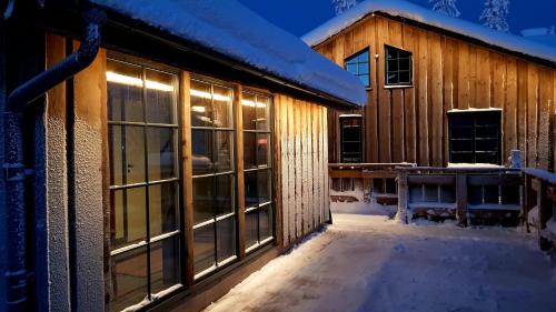 a building with windows in the snow at Fjällhem in Sälen