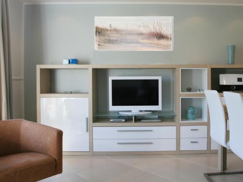 TV a/nebo společenská místnost v ubytování Haus Südwind am Ostdeich