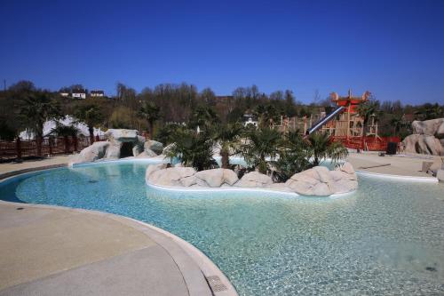 a large swimming pool in a theme park at Les Pagodes de Beauval in Saint-Aignan