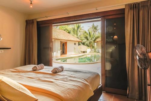 Postel nebo postele na pokoji v ubytování Baan Ya Kha exclusive Villa 5 bedrooms