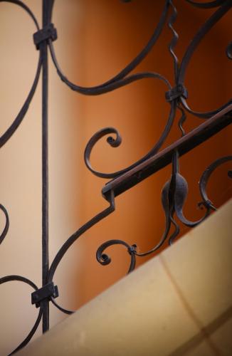 a close up of a black metal fence at Fontevraud L'Ermitage in Fontevraud-l'Abbaye