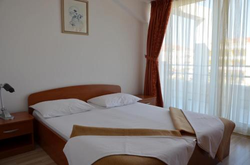 Postel nebo postele na pokoji v ubytování Apartments Pirovcanka