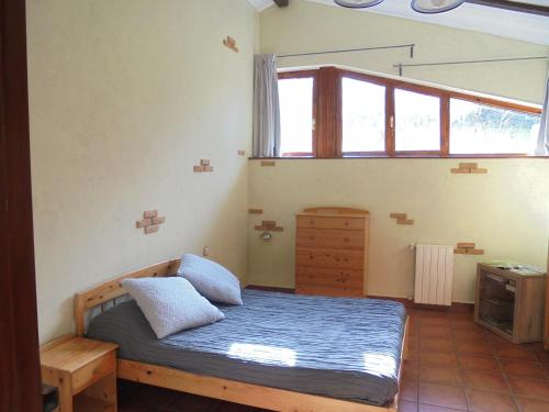 Ένα ή περισσότερα κρεβάτια σε δωμάτιο στο Albergue Areitz Soroa