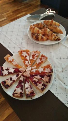 two plates of food on top of a table at Torrione Hotel in Reggio Calabria
