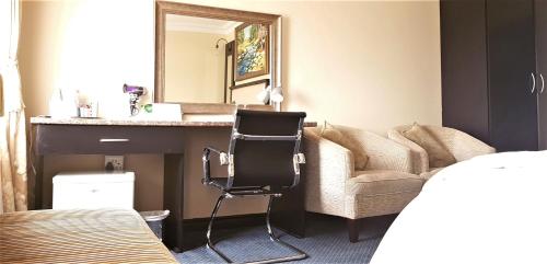 Katil atau katil-katil dalam bilik di Constantia Manor Guest House