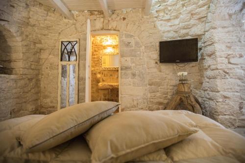 Letto o letti in una camera di Widespread Trulli in the historic center - Trulli Antichi Mestieri
