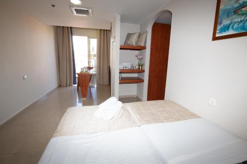 Postel nebo postele na pokoji v ubytování Motel Aviv