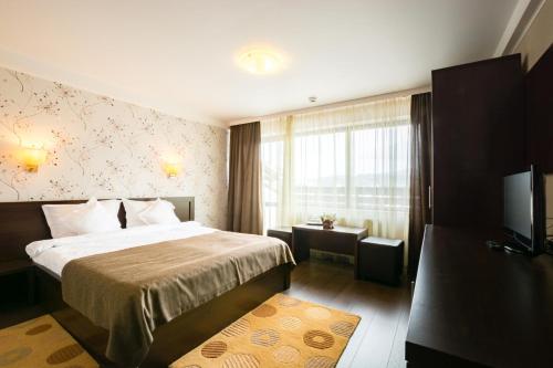 Säng eller sängar i ett rum på Vila Hera Luxury