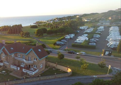 an aerial view of a house and a parking lot at Gijon Surf Hostel in Gijón