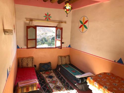 Una cama o camas en una habitación de Amtoudi Aventure