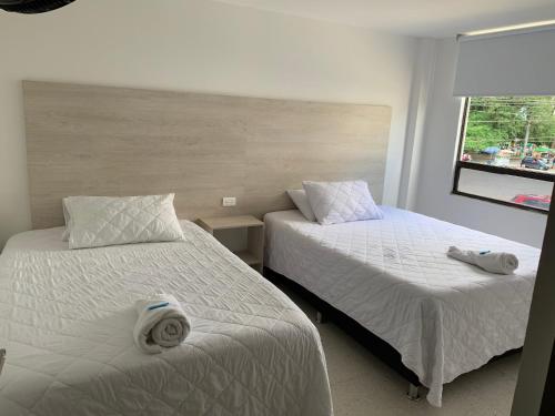 מיטה או מיטות בחדר ב-Hotel Mirador San Esteban