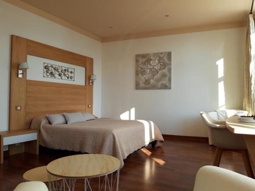Postel nebo postele na pokoji v ubytování Hôtel la Guimbarde