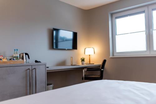 Postel nebo postele na pokoji v ubytování Hotel Circle Inn