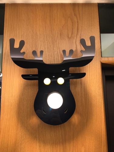 a door with a reindeer head on it at Lantan Fanyue Inn in Chiayi City
