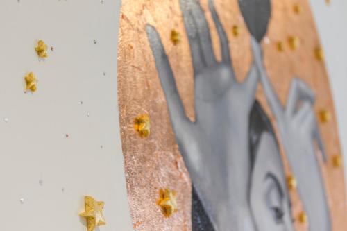 a close up of a clock with bees on it at X.O Art House in Cusco