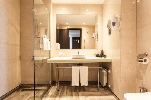 a bathroom with a sink and a shower at Hotel Orlovetz in Pamporovo