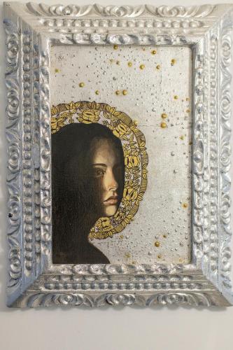 a painting of a black woman in a frame at X.O Art House in Cusco