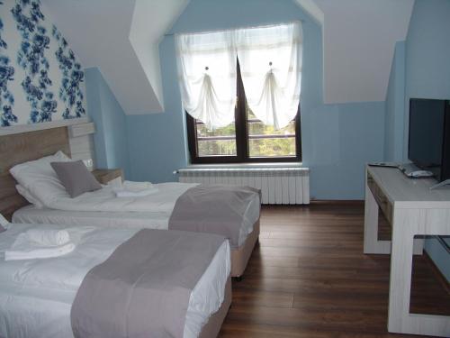 Ένα ή περισσότερα κρεβάτια σε δωμάτιο στο Villa Eva