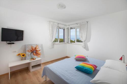 Postel nebo postele na pokoji v ubytování Villa Mirta in Crni (Haus für 8 Personen)