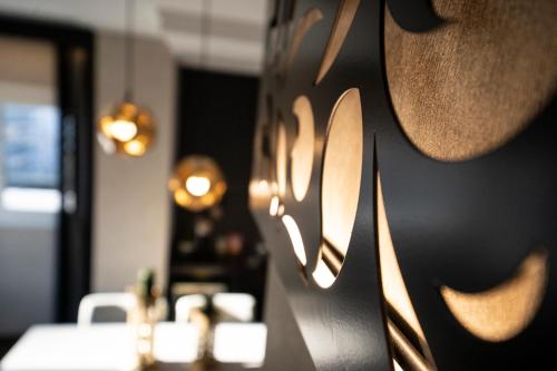 a wall with lights on it in a restaurant at Egnatia Palace Hotel & Spa in Thessaloniki