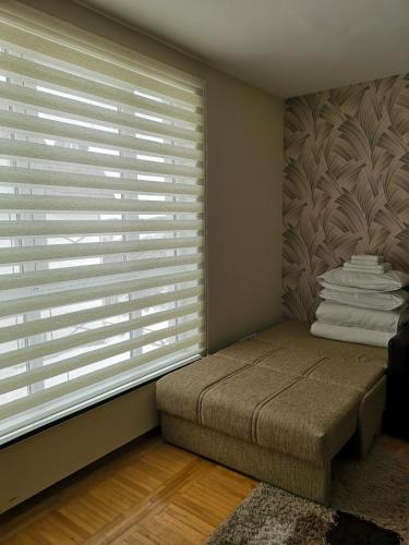 Una cama o camas en una habitación de Apartman 33 Kraljevi Čardaci