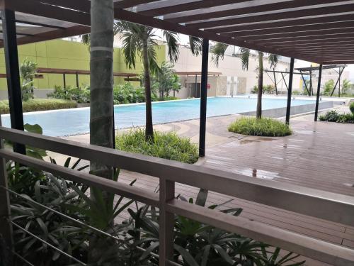 a view from the balcony of a resort with a swimming pool at Centrio Tower Beside Ayala Studio Unit with Balcony 23 in Cagayan de Oro
