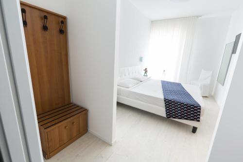 Ένα ή περισσότερα κρεβάτια σε δωμάτιο στο Hotel Cavallino Bianco