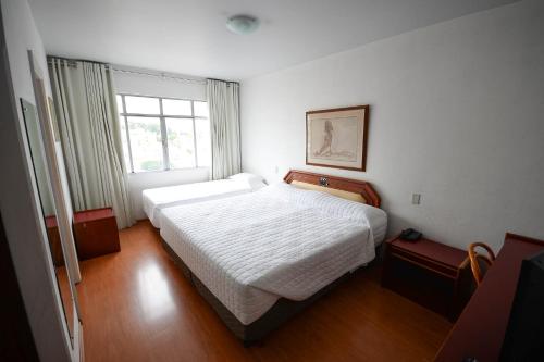 Ένα ή περισσότερα κρεβάτια σε δωμάτιο στο Caravelle Palace Hotel