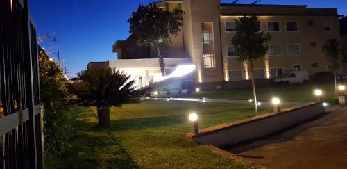 a house with lights in the yard at night at Hotel San Germano in Piedimonte San Germano