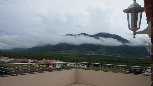 a balcony with a view of a mountain at Seller Hotel in Sobral