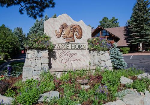 a sign for the entrance to a village resort at Rams Horn Village Resort in Estes Park