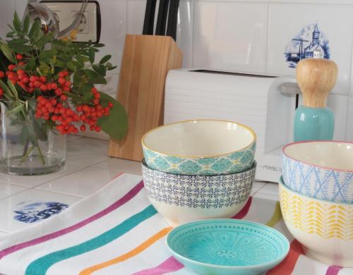 a group of bowls sitting on a kitchen counter at Casa de Piedra in Valderrueda