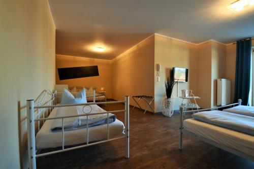 a bedroom with two bunk beds in a room at Motel Füssen im Allgäu in Füssen