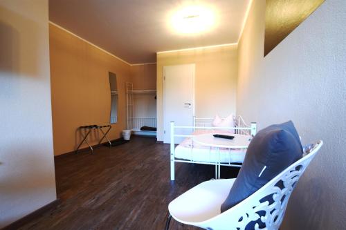 a room with a bed and a table and a chair at Motel Füssen im Allgäu in Füssen