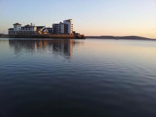 a large body of water with buildings in the background at The York Hotel in Weston-super-Mare