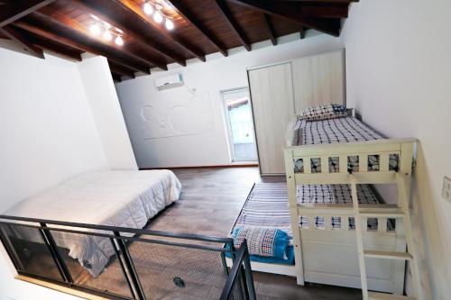 Postel nebo postele na pokoji v ubytování Hermosa Casa con Pileta Roldán Funes Rosario