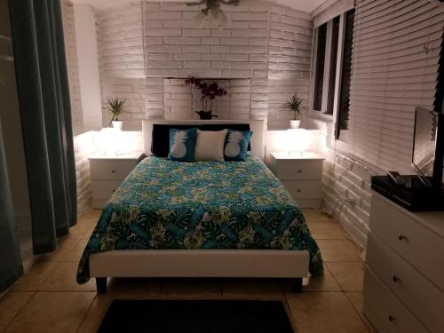 
a bedroom with a bed and a window at Beachbound in Miami
