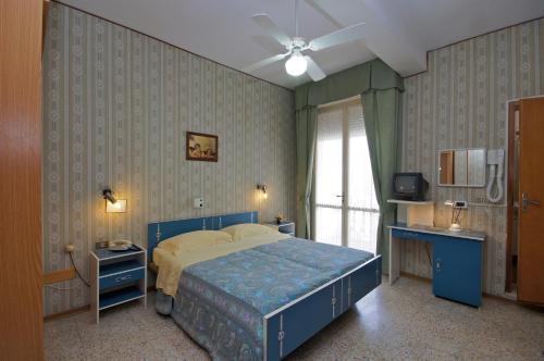 מיטה או מיטות בחדר ב-Hotel Victory