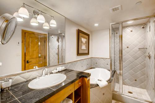 a bathroom with a sink and a shower at Gravity Haus Vail in Vail