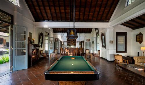 a pool table in the middle of a room at MesaStila Resort and Spa in Borobudur