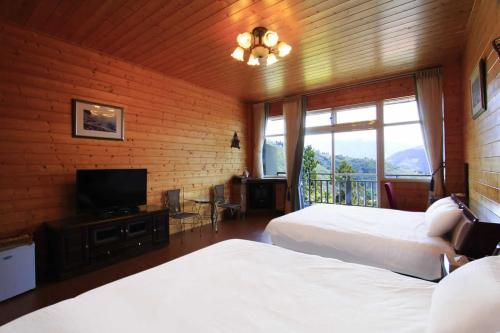Postel nebo postele na pokoji v ubytování Yun Meng Xianjing Homestay
