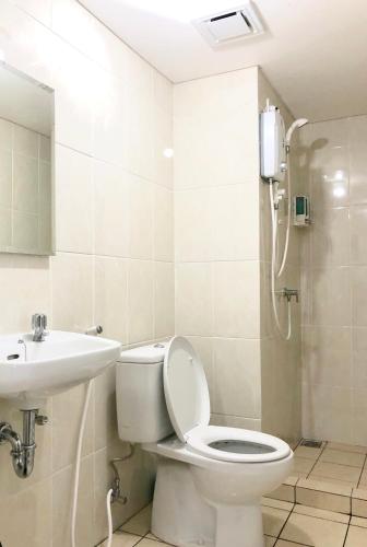 a bathroom with a toilet and a sink and a shower at M-Town Residence Gading Serpong by Taslim Property in Tangerang