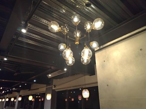 a chandelier hanging from a ceiling in a room at Lantan Fanyue Inn in Chiayi City