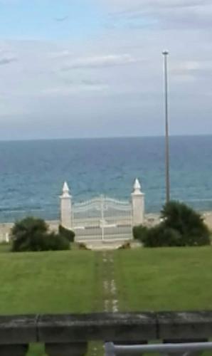 a view of a park with the ocean in the background at Villa Longo de Bellis in Bari
